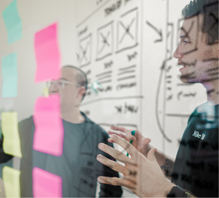 Two male employees discussing their ideas